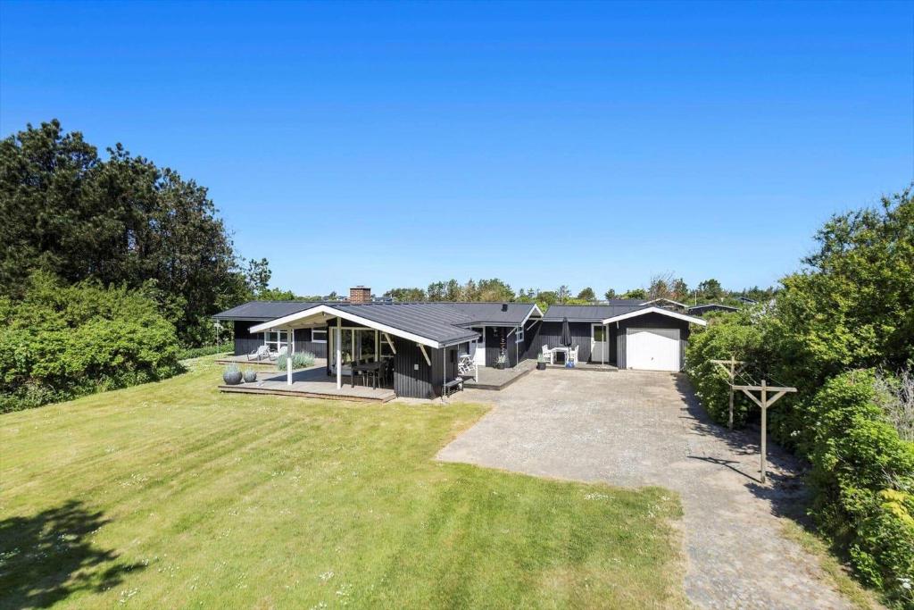 a house with a large yard in front of it at LN866-Hjorring-Ostersovej-34 in Hjørring