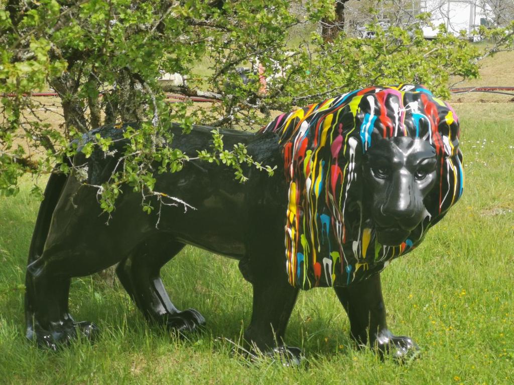 a statue of a bear wearing a hat at Coeur de bull' in Cahuzac-sur-Vère