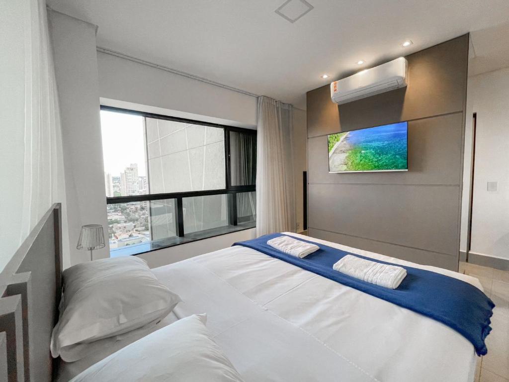 En eller flere senge i et værelse på Alto Luxo e uma Bela Vista no Edifício Vertigo