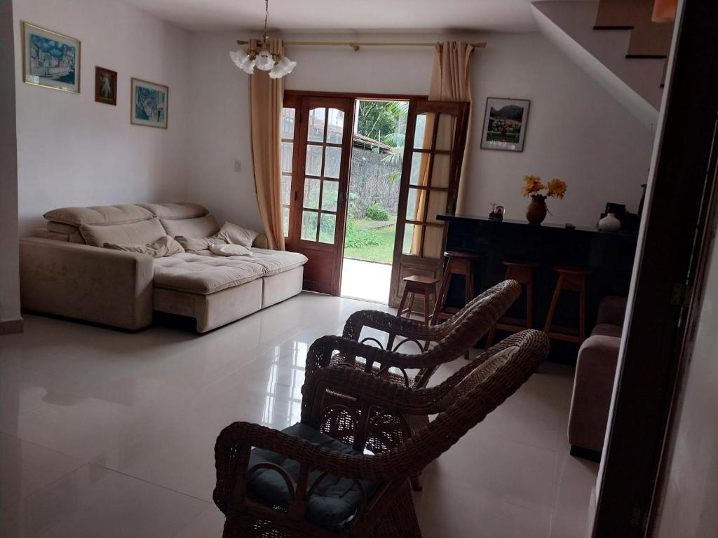 a living room with a couch and chairs in it at Cop 30 urban Amazon Paradise 5 bedrooms 7 beds in Ananindeua