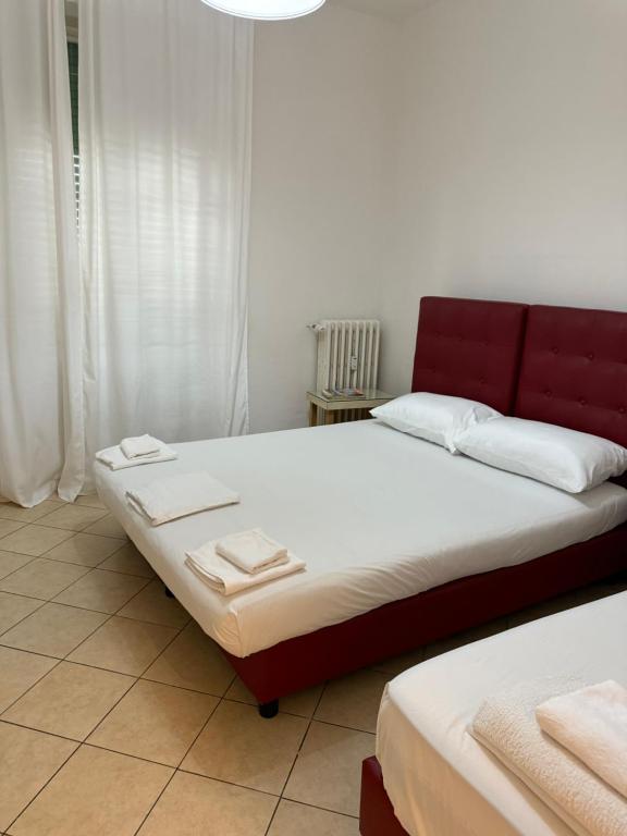 Ένα ή περισσότερα κρεβάτια σε δωμάτιο στο Leoncavallo Apartment