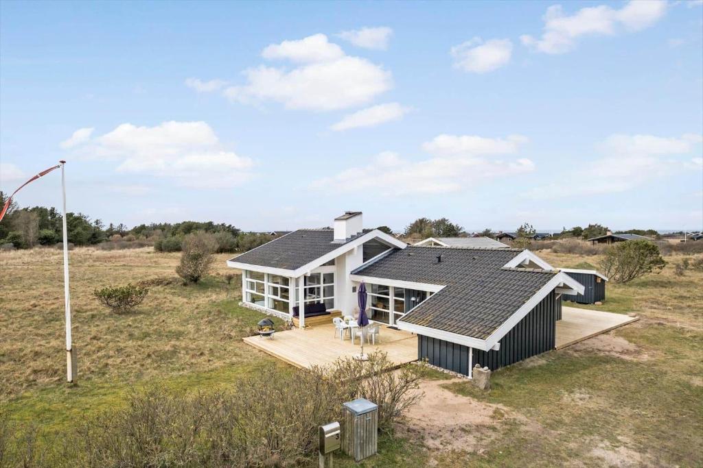 an aerial view of a house in a field at LN1911-Hjorring-Under-Bjergene-3 in Hjørring
