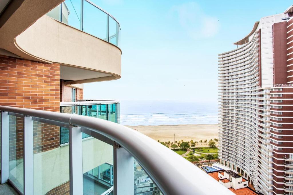 a balcony with a view of the ocean from a building at Condomínio Estanconfor Santos Vista Mar in Santos