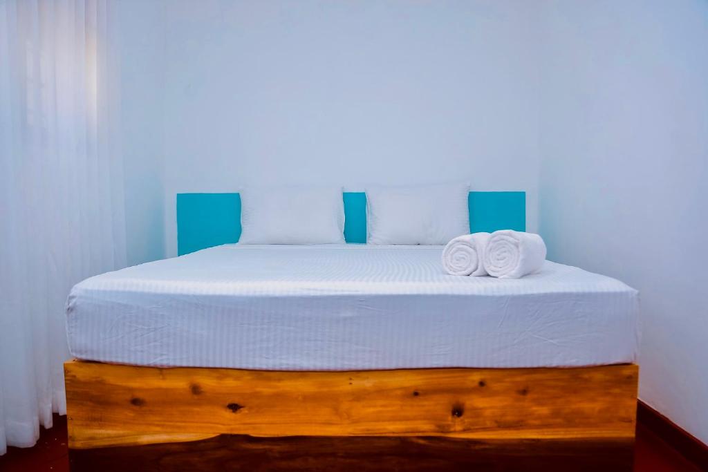 Giường trong phòng chung tại Daro's Enclave