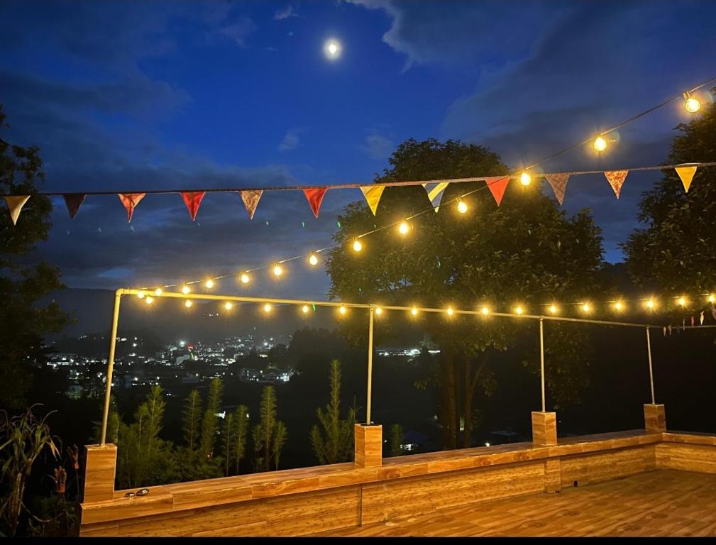 a string of lights on a balcony at night at Holiday cabin in Sibey in Hāpoli
