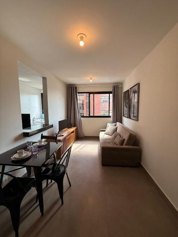 En eller flere senge i et værelse på LK Santa Efigênia 1