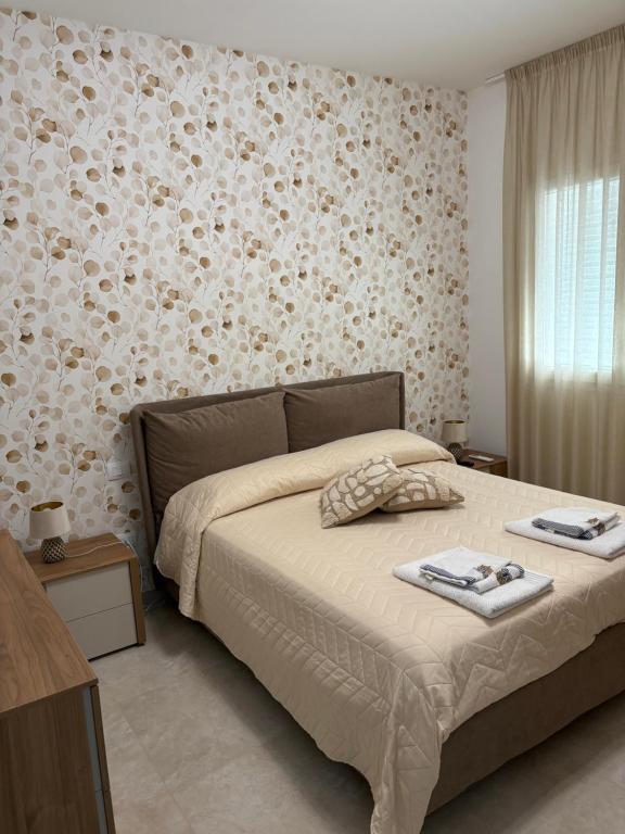 Postel nebo postele na pokoji v ubytování Boutique Valeria