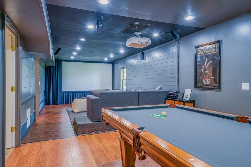a living room with a pool table and a couch at Fuji Falls Cabin in Black Mountain