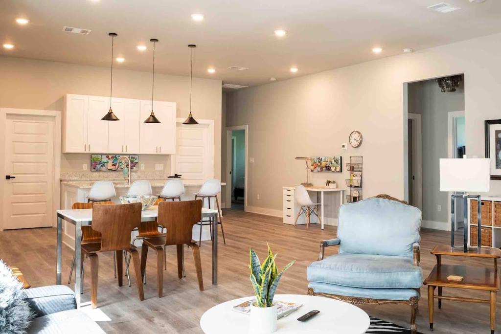 a kitchen and living room with a table and chairs at Best Rated! Families-Weddings-ATX-Hill Country in Kyle