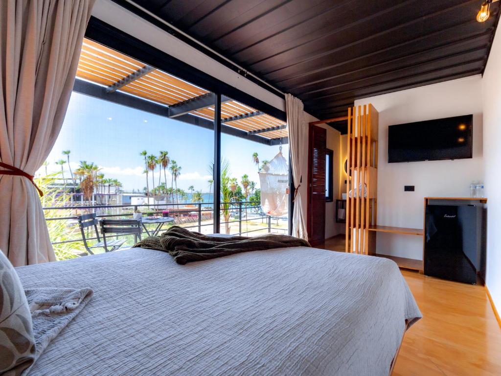 Postel nebo postele na pokoji v ubytování InHouse Glamping Hotel La Paz