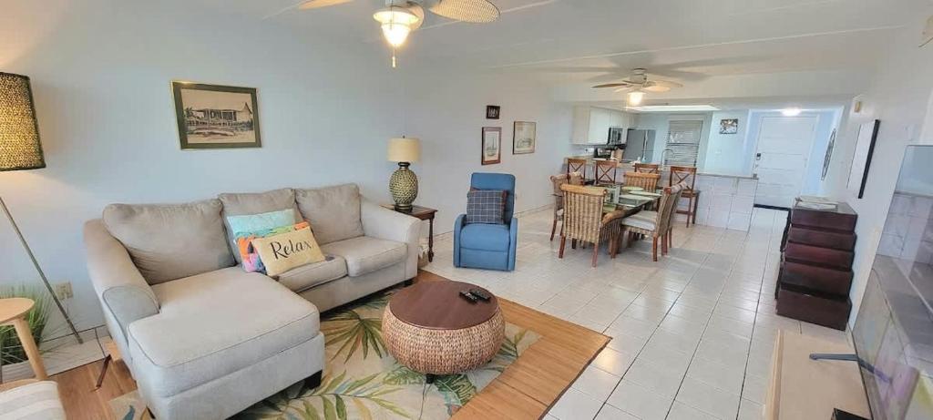 a living room with a couch and a table at Saida Towers II #104 condo in South Padre Island