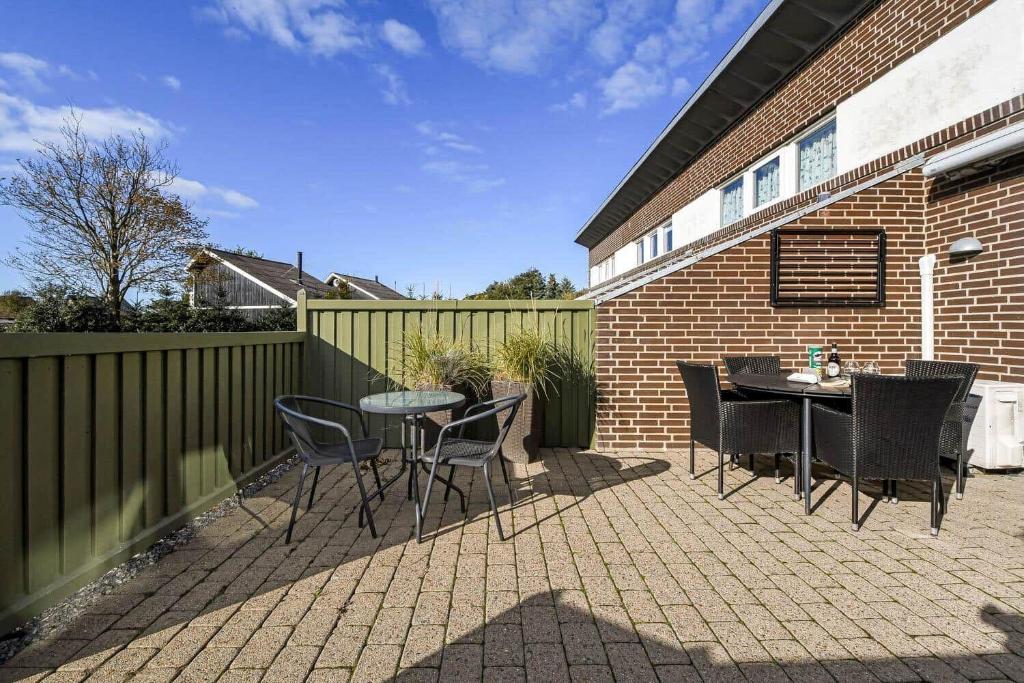 a patio with a table and chairs and a fence at C11699-Hemmet-Vester-Faelled-70-A5 in Hemmet