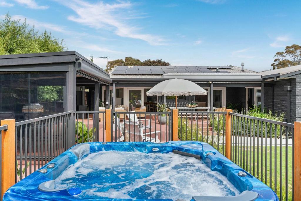a hot tub in the backyard of a house at Luxury Retreat - Spa Beach Golf Wineries in Mornington