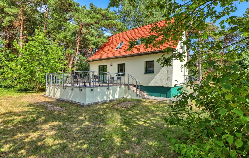 a white house with a red roof at Beautiful Apartment In Altenkirchen With Wifi in Altenkirchen