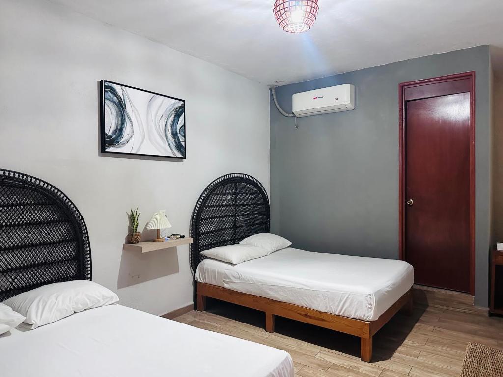 Postel nebo postele na pokoji v ubytování Hotel Ashley