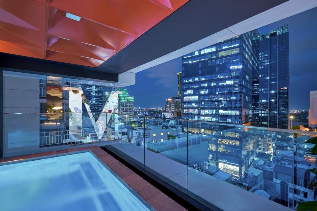 a view of a city skyline from a building at Signature by M Village Lê Thánh Tôn in Ho Chi Minh City