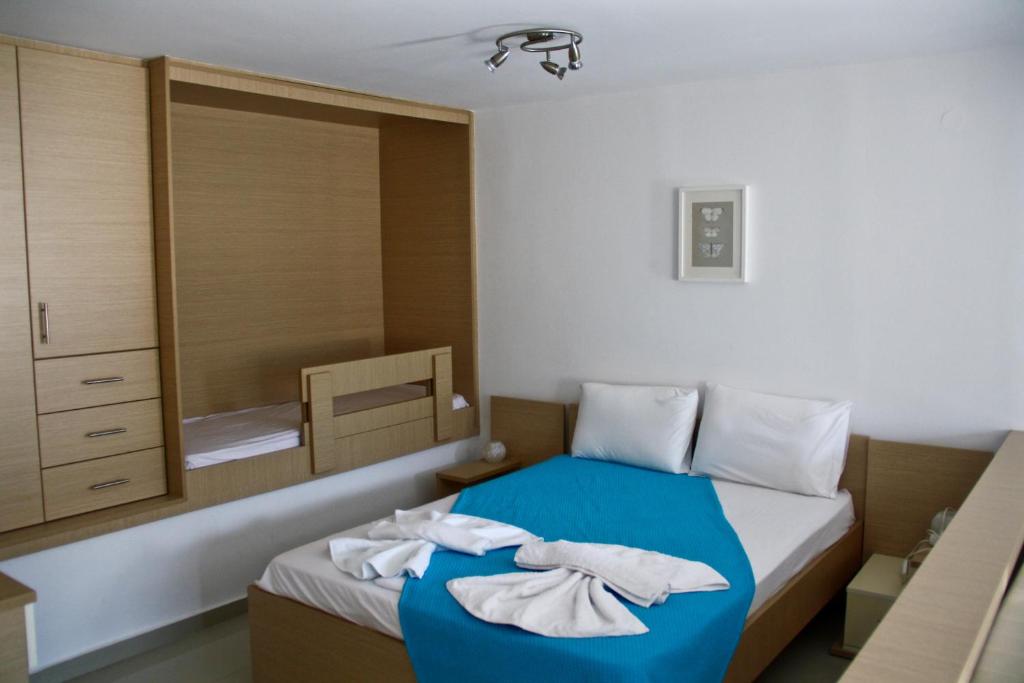 Postel nebo postele na pokoji v ubytování SunOrama Apts-Studios