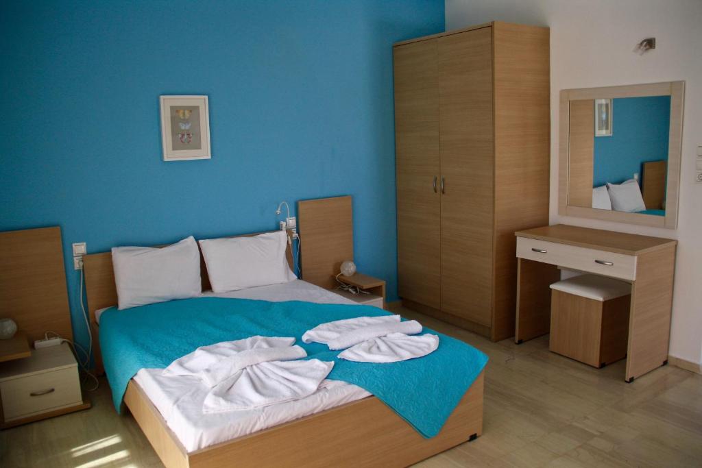 Postel nebo postele na pokoji v ubytování SunOrama Apts-Studios