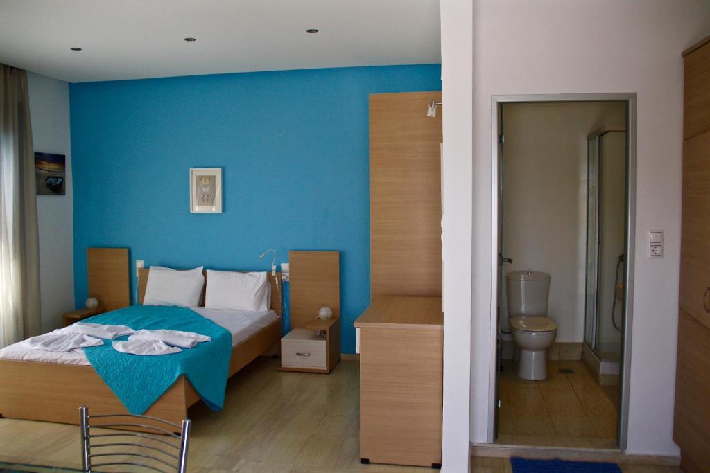 Postel nebo postele na pokoji v ubytování SunOrama Apts-Studios