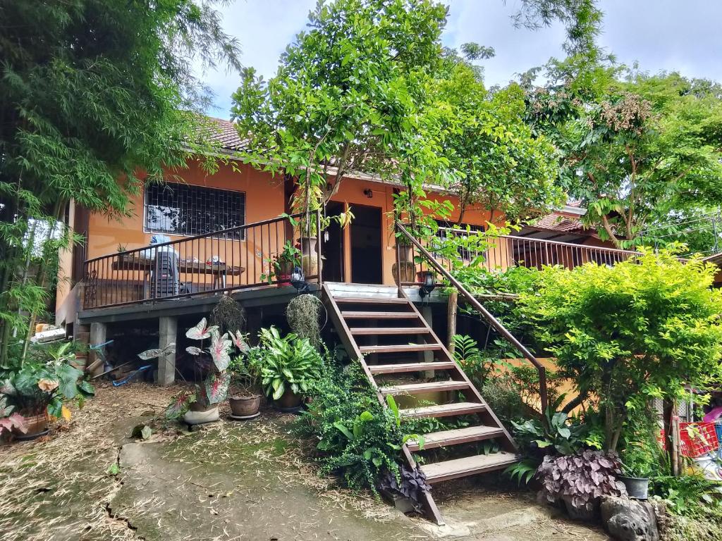 een huis met een trap ervoor bij Stay here at pai in Pai