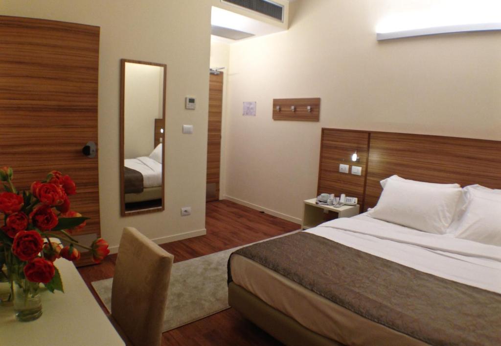 Postel nebo postele na pokoji v ubytování Hotel Forum