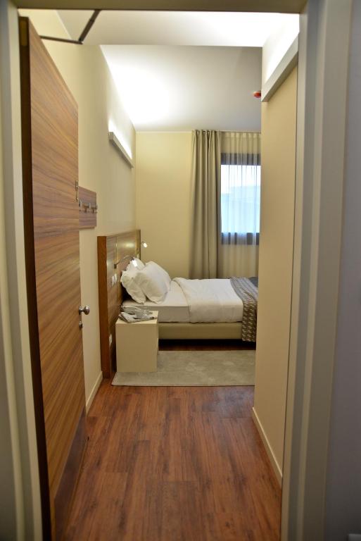 Postel nebo postele na pokoji v ubytování Hotel Forum