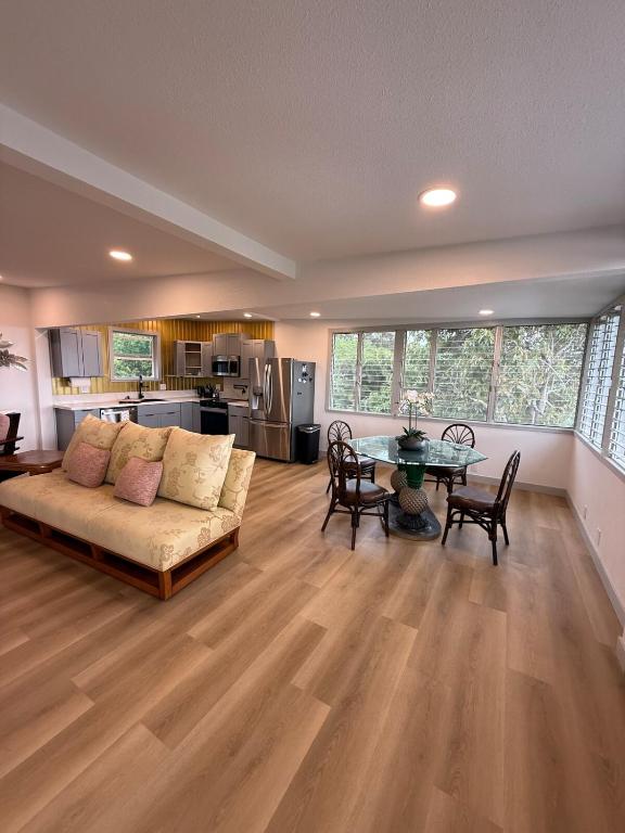 a living room with a couch and a table at Mountain Home 4 Family and Friends in Captain Cook