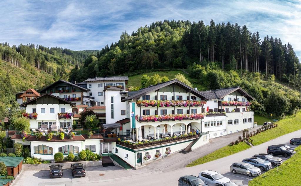 an aerial view of a hotel in the mountains at Panoramahotel Gürtl in Haus im Ennstal