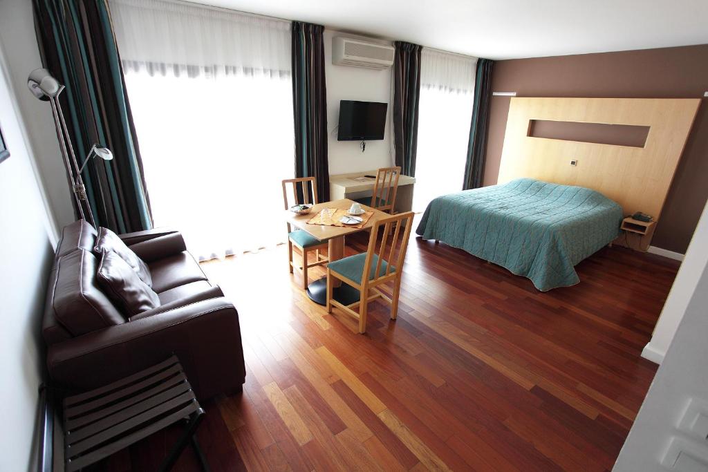 Postel nebo postele na pokoji v ubytování Hôtel la Scala
