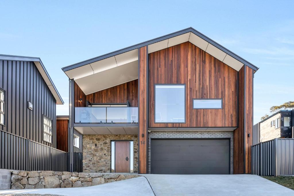 a modern house with a garage at 14 Abbott Street - Entire in Jindabyne