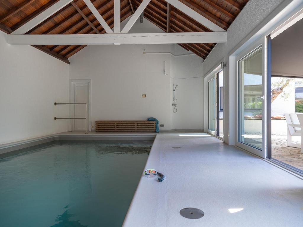 an indoor swimming pool in a house at Heated Pool & Beach Access in Koksijde