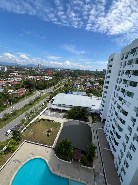 an aerial view of a building and a pool at Likas Square serviced apartment with garden view in Kota Kinabalu