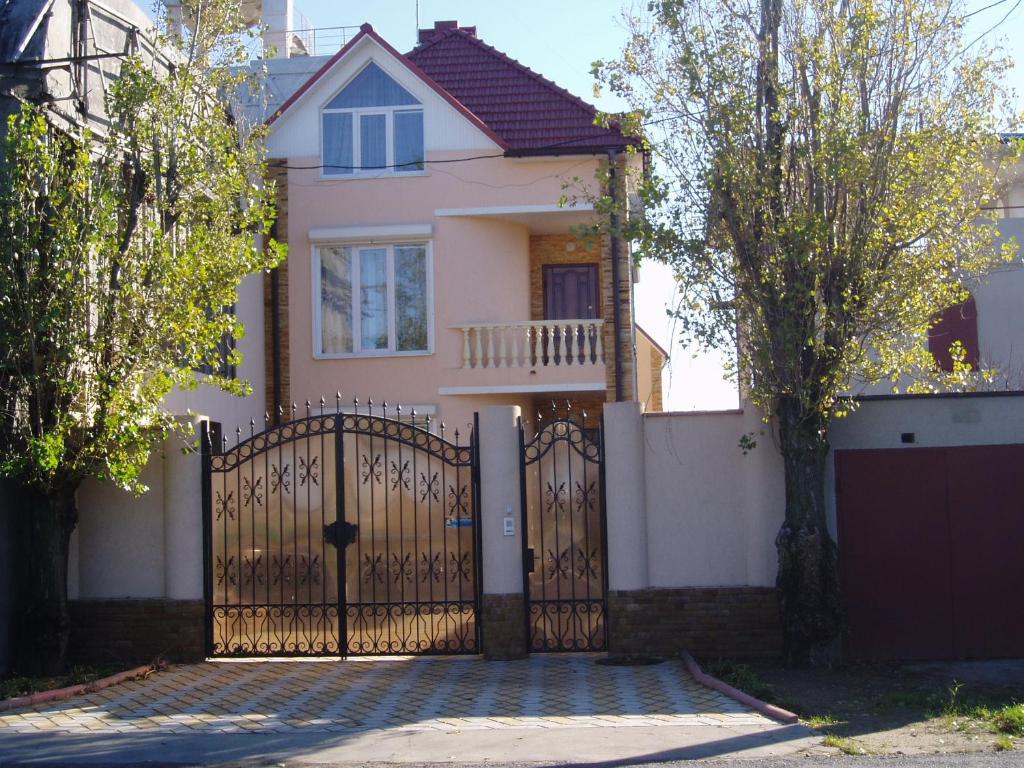 a house with a gate in front of it at Raduga 514 in Zatoka