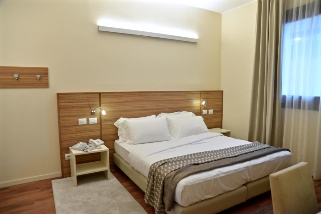 Postel nebo postele na pokoji v ubytování Hotel Forum