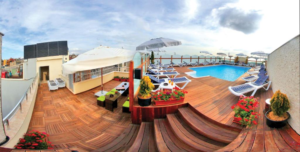 a row of boats sitting on top of a wooden deck at Hotel Istanbul Trend in Istanbul