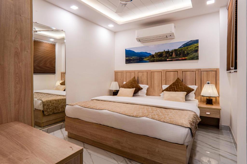 a bedroom with two beds in a room at Urban Oasis in New Delhi