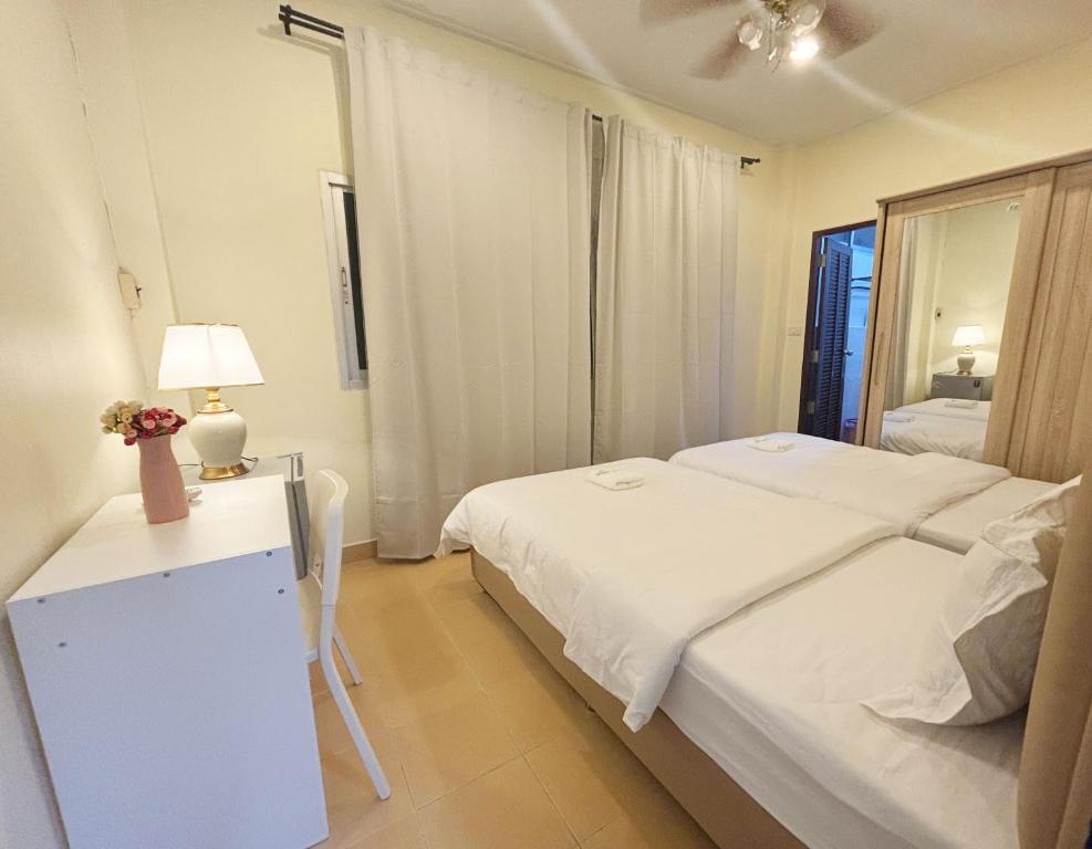 Ένα ή περισσότερα κρεβάτια σε δωμάτιο στο Apamet Hotel