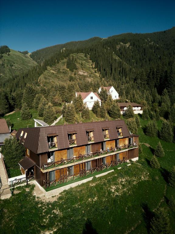 an aerial view of a building in the mountains at Pana Nomad Kolsay in Kurmenty