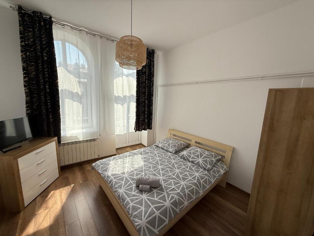 Postel nebo postele na pokoji v ubytování Apartament Panorama Centrum