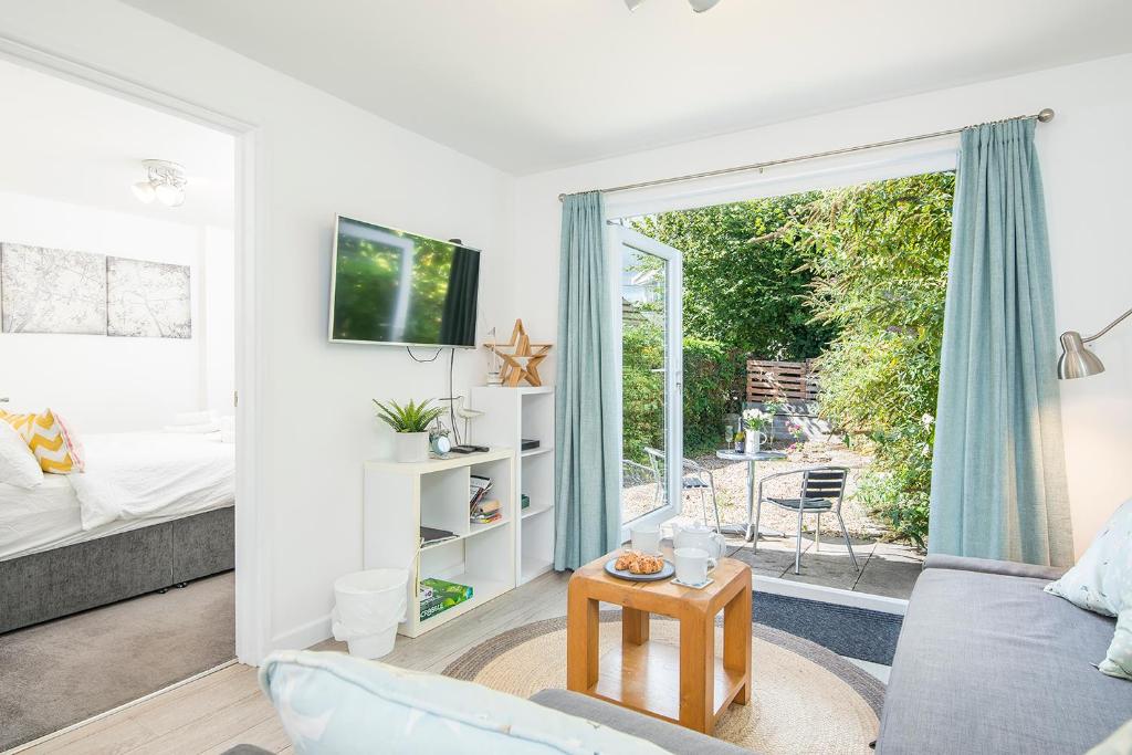 TV/trung tâm giải trí tại The Rath Cottage