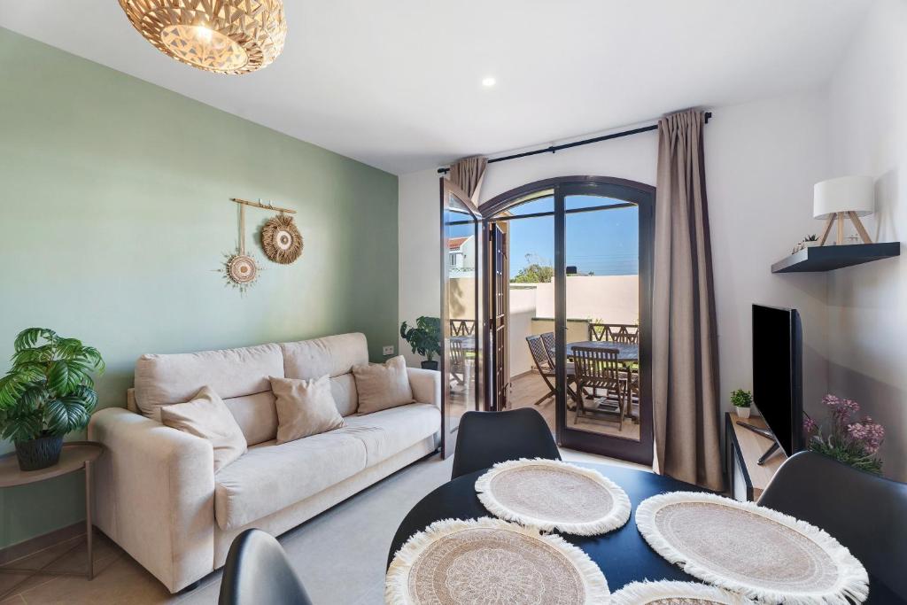 a living room with a couch and a table at Casa Tagoro Dream in Costa Del Silencio