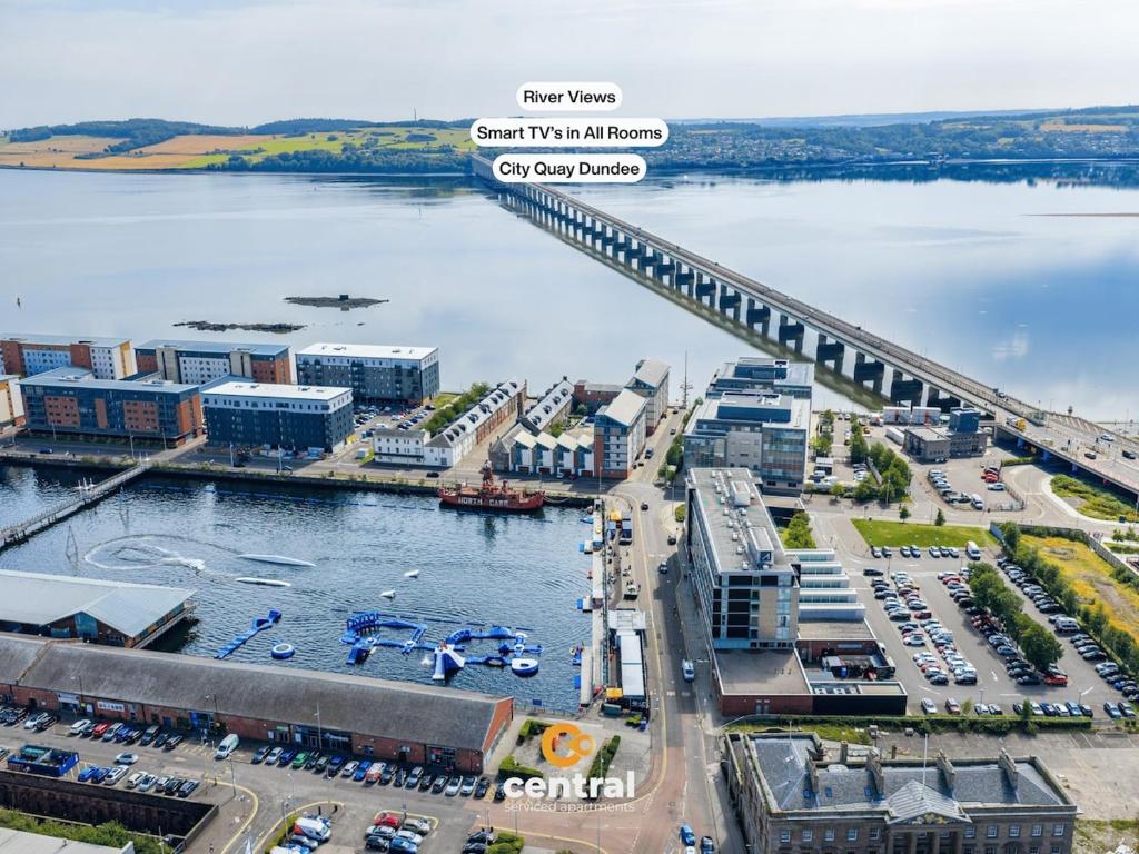 an aerial view of a city with a bridge at CENTRAL SERVICED APARTMENTS - City Quay - 2 Bedrooms - En-Suite Bathroom - Dedicated Parking Space - Fully Equipped - Walk Away From Dundee Bus & Train Station - Close to City Centre with River Views and Balcony - NEW in Dundee