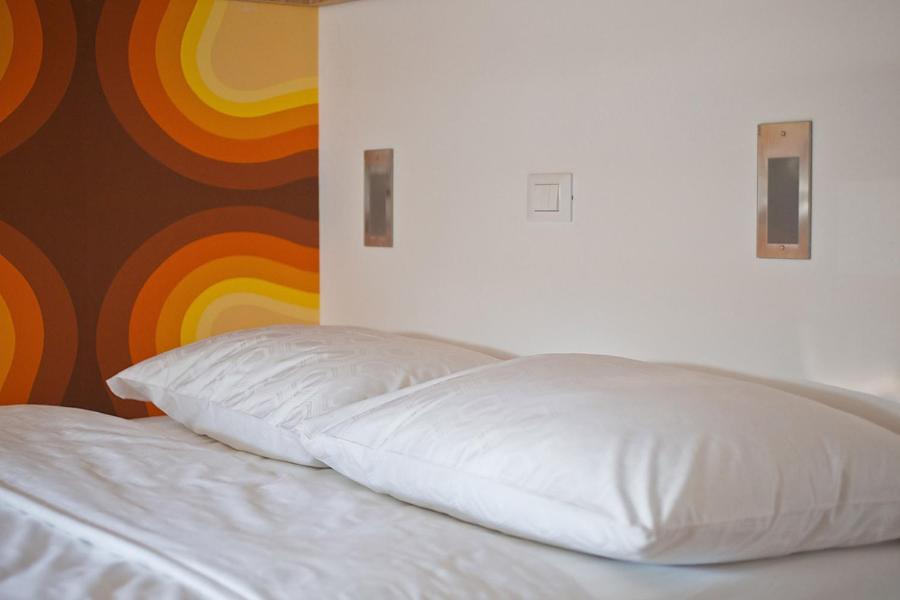 Postel nebo postele na pokoji v ubytování Bit Center Hotel