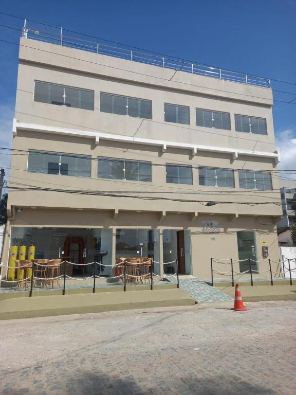 a large white building with a lot of windows at Tamandaré Divers Resort in Tamandaré