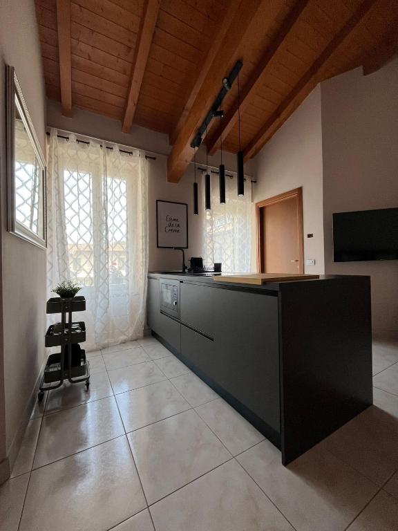 a kitchen with a large island in a room at Appartamento i13-C in Magenta