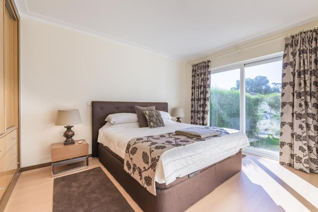 Postel nebo postele na pokoji v ubytování V4 Duplex Quinta do Lago Sal