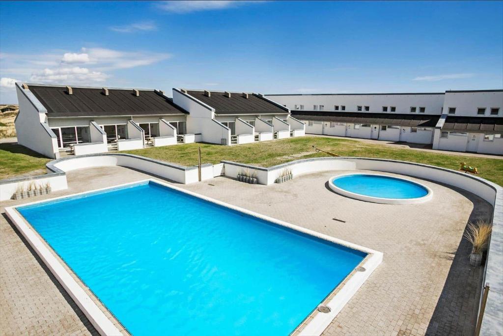 an image of a house with a swimming pool at JB889-Brovst-Strandvejen-150-Lejl-130 in Tranum Strand