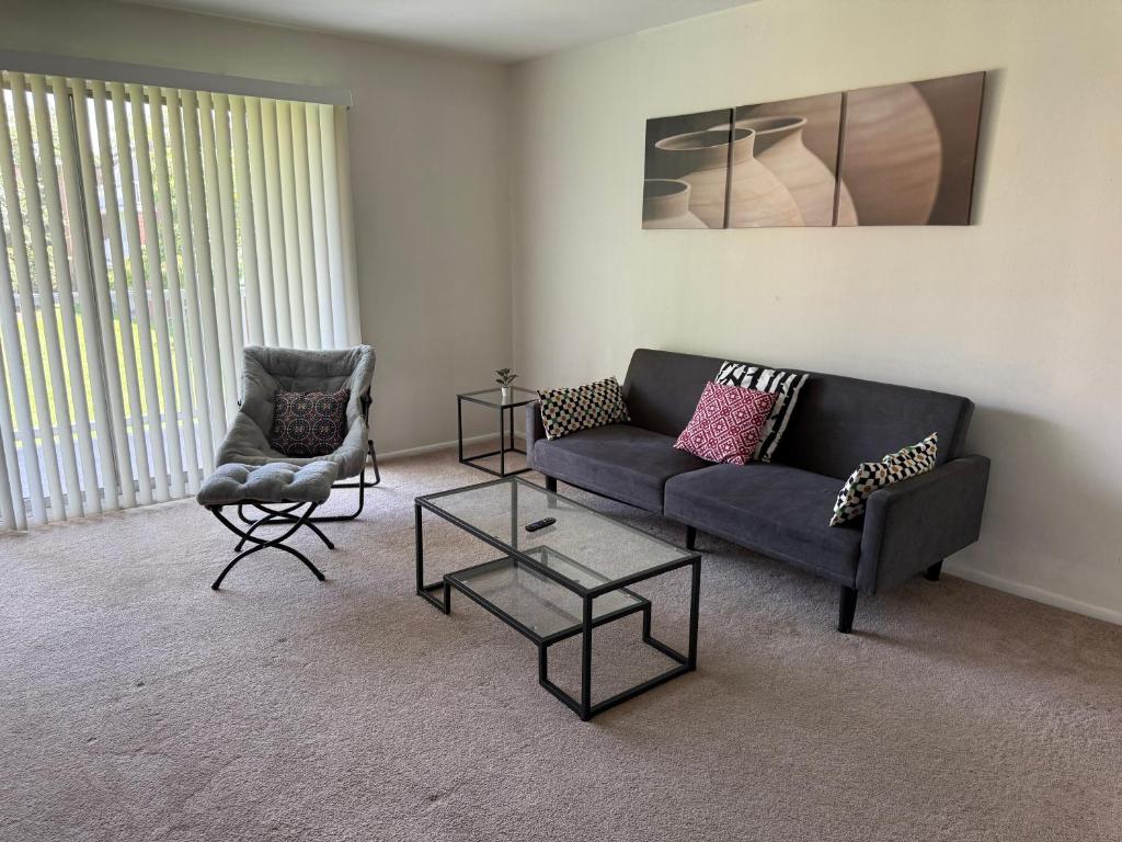 a living room with a couch and two chairs at Modern 1br Retreat In Elkins Park - Long Term in Jenkintown