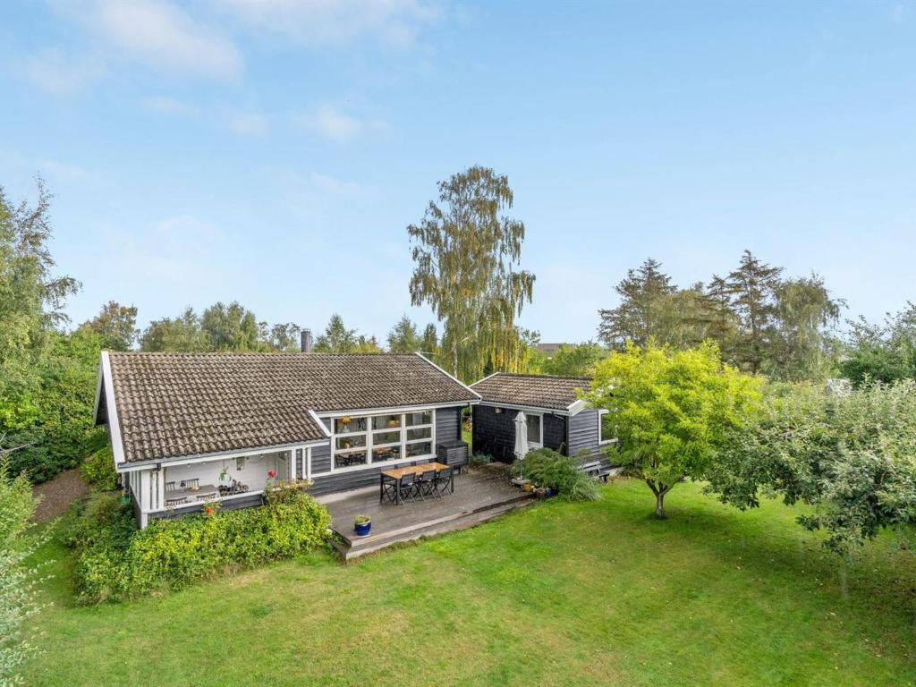 an aerial view of a house with a yard at Holiday Home Gærmund - 350m from the sea by Interhome in Føllenslev