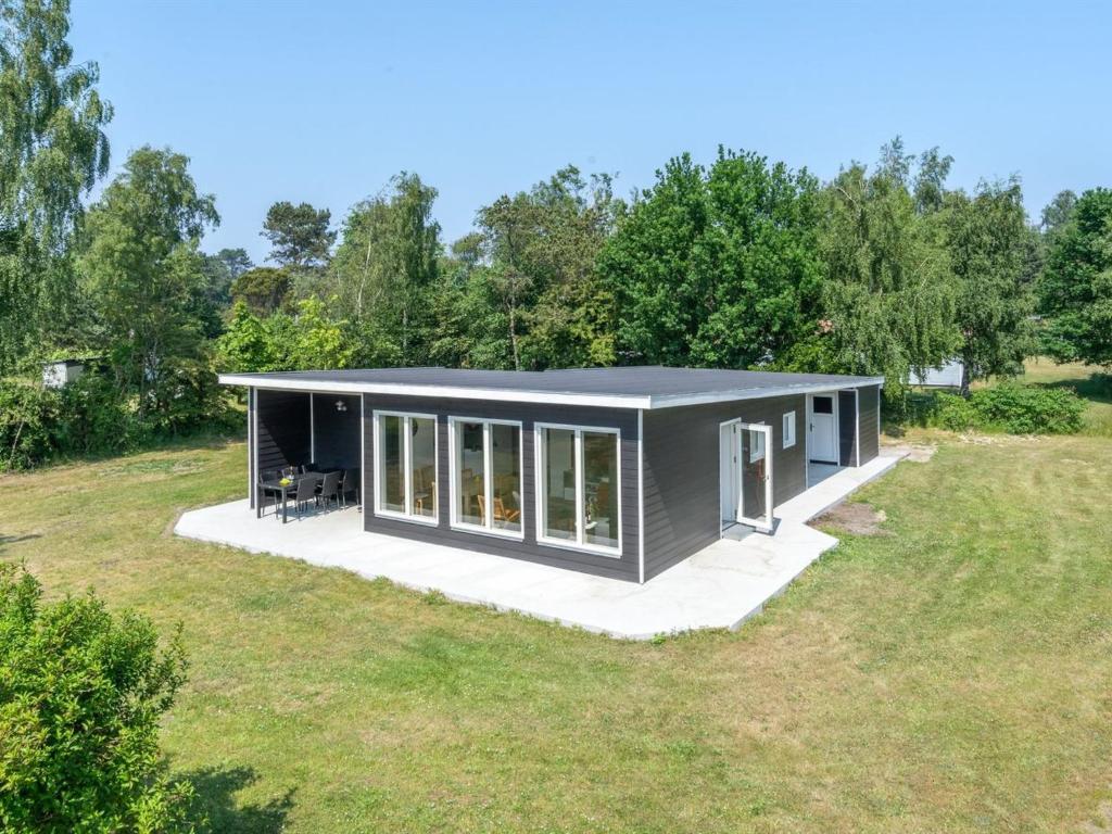 a rendering of a tiny house in a field at Holiday Home Sighmund - 530m from the sea by Interhome in Yderby